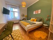 Mustard-colored apartment for two