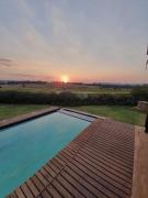 Sip golden sunsets from this endless decked patio