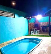 Casa do lado da praia com piscina, churrasqueira e ar condicionado