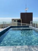 Flat Golden Beach Home - Prédio de frente para o Mar