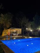 Detached villa with a heated pool and garden