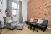Stylish Apartment with Mezzanine, next to Metro Station by Noclegi Renters