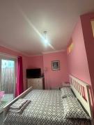 Paignton seafront Apartment with Private Garden ,FREE Private Car Space FREE WIFI ,No kitchen but Fridge Tea coffee Towels YES Double & Single bed YES Reception to help you YES Opposite the Beach Yes