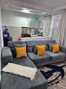 CM Snug stay -Naivegas Apartments