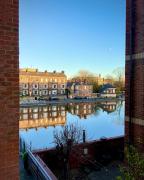 Riverside city-centre apartment with parking