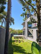 Casa Woods seu Refúgio na Praia do Estaleiro