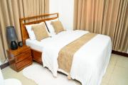 The Modern Nest Stylish 1BR MbeziBeach with Fast WiFi, Work Desk & Smart Home