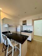 Modern apartment one block from the beach