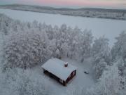 Log cabin on the banks of Ounasjoki River