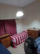 Cama en habitación compartida