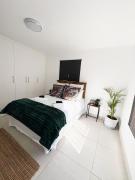 Central beach apartment with African flair