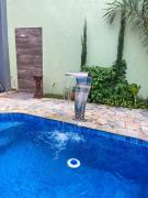 Casa com piscina e cascata e spa fogão a lenha