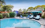Private Oasis with Heated Saltwater Pool Tropical Backyard