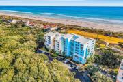 Oceanfront condo with direct beach access, pool, balcony, grilling area, & AC
