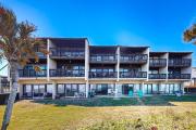 Oceanfront condo with resort amenities, beach access and pool