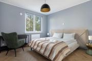 Elegant Apartment in Poznan for Remote Work with Parking and Balcony by Noclegi Renters