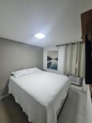Suíte completa e poucos metros da praia