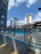 modern serenity suites apartments with swimming pool,modern equipped gym,private parking space, children playing ground, proximity to major shopping malls and unbeatable city views