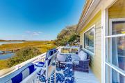 Light-filled coastal stay with open layout, water views, washerdryer, and AC