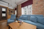 Loft Apartment in a Well-Connected District in Warsaw by Noclegi Renters
