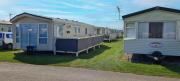 Lovely Caravan With Decking At Coral Beach Park In Lincolnshire Ref 77001Cb