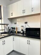 The comfort executive loft three bedroom apartment with amazing breathtaking city views , swimming pool ,gym ,private ample parking space with designated child playground area