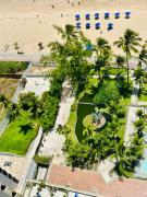 Flat pe na areia frente mar