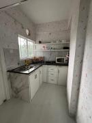 The Golden Mirror A Warm 1BHK with Balcony