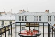 Apartment with balcony under the roofs of Paris