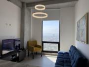 Suite Elegante con Vistas a la Ciudad y estacionamiento