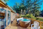 Cozy abode steps from the beach with a private hot tub and nautical theme