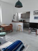 The feet in the sand - and town