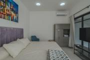 3 bedrooms home one block from the beach with pool, very central location