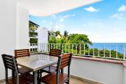 Luxury hillside suite with infinity pool, ocean views, hot tub & terrace seating