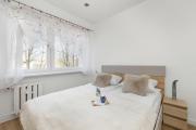 Jasny Apartament z Balkonem by Noclegi Renters