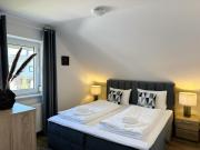 Modernes Ferienhaus "Küstenperle-Haffkrug" mit gemütlicher Terrasse & Stellplatz - nur 4 Minuten zum Strand