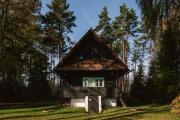 Cozy wooden cottage by the lake with a sauna