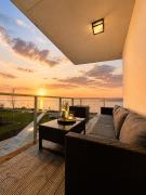 LUXURY WATERFRONT APARTMENTS WITH SEA VIEWS, SUNSET TERRACES and FREE PARKING, ONE WITH A HUUM SAUNA, THE OTHER WITH A BATHTUB