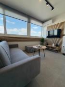 Bright 6th Floor Apartment Steps from Metro