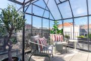 Rooftop Glasshouse Retreat by LovelyStay
