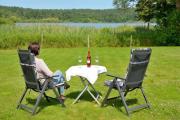 Ferienhaus am See auf großem Grundstück, Kaminofen
