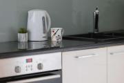Black and Blue Apartment in Warsaw with Desk and Parking by Noclegi Renters