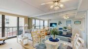 Sunny coastal condo with beach views balcony pools gym sauna & AC