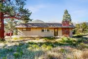 Enjoy Nature from this Charming Cabin with Deck, Fireplace, & Washer and Dryer