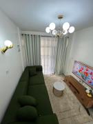 Cozy Modern 1BR with views on 10th floor at TSAVO APARTMENTS near TRM 15 mins to CBD