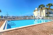 Dog-friendly charming beach condo with pool hot tub sauna deck & water access