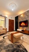 Cozy Retreat in Arusha - power 24hrs -Firepit - Free Parking- Garden swing- Fast Wi-Fi