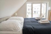 Moderne und gemütliche Dachgeschosswohnung mit Balkon, zentrale & ruhige Lage, 500m zum Strand