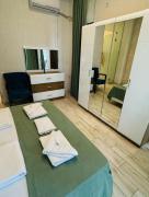 Private One-Bedroom Apartment with kitchen and balcony at a Hotel