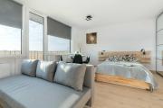 Beige and Grey Studio in Gdańsk with Balcony Close to the Beach by Noclegi Renters